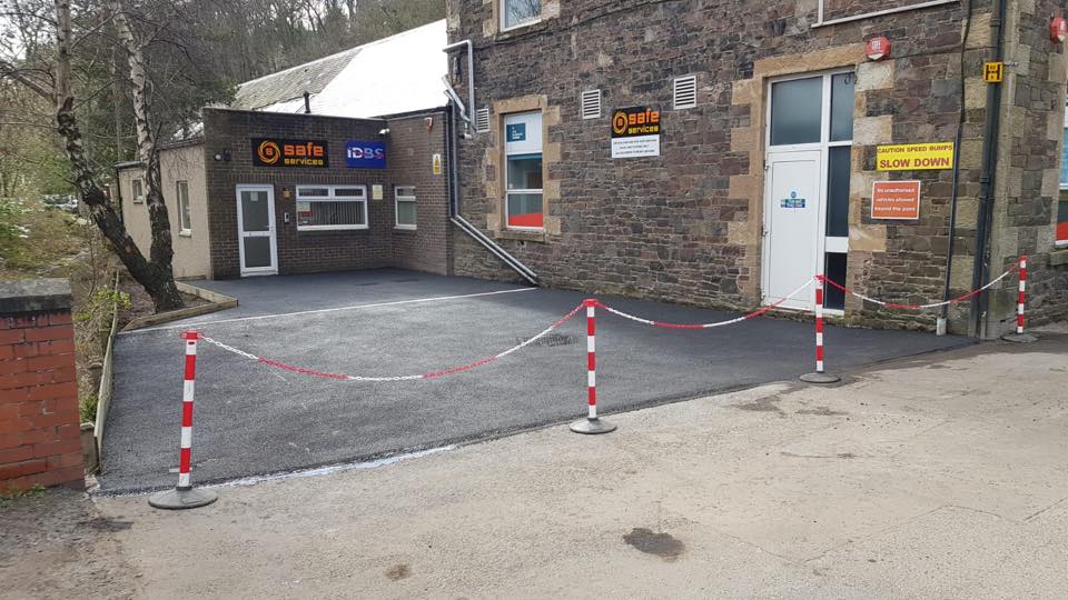 new tarmac parking area with aqua channel drainage timber edging