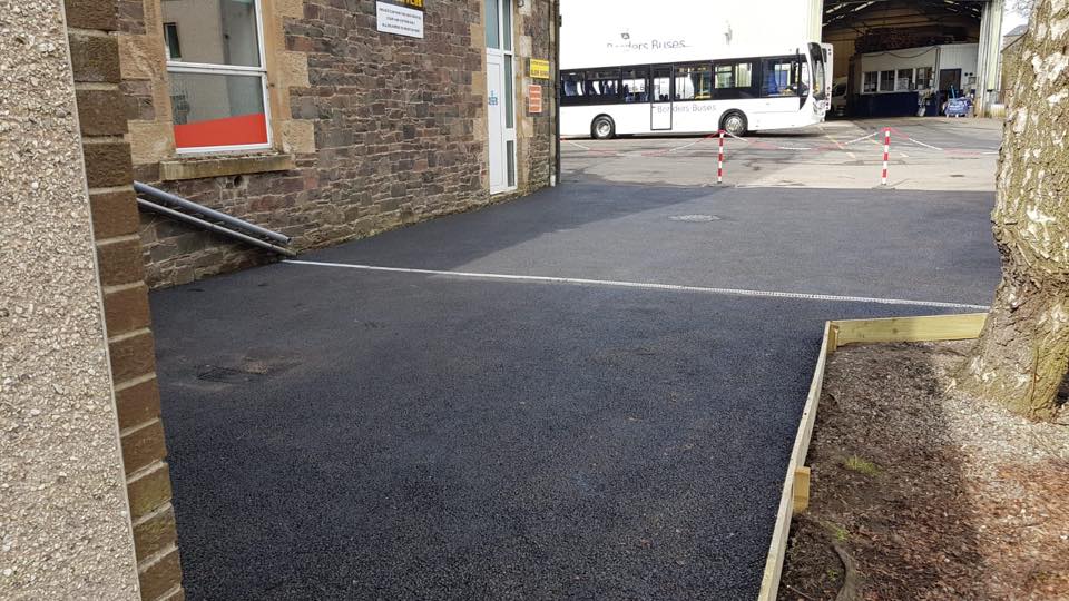 new tarmac parking area with aqua channel drainage timber edging